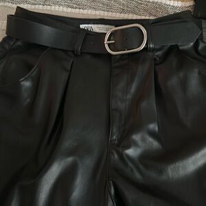 Black faux leather dress pants.